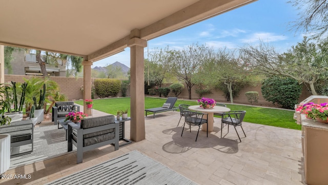 view of patio / terrace featuring an outdoor hangout area, outdoor dining area, and a fenced backyard