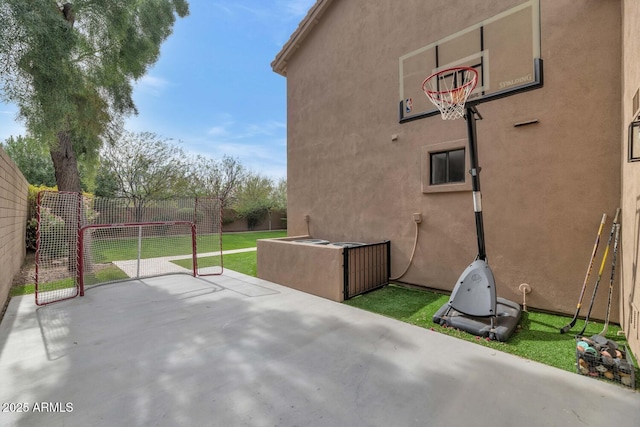 view of patio featuring fence