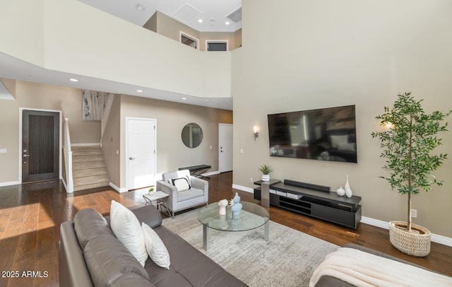 living room featuring recessed lighting, stairway, baseboards, and hardwood / wood-style flooring