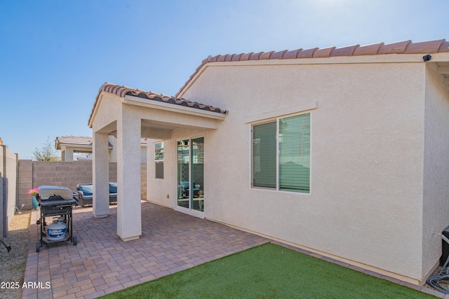 view of patio featuring a grill