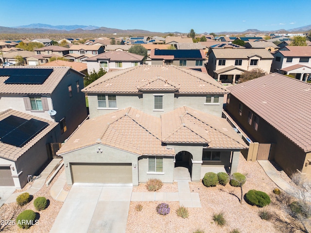 drone / aerial view with a mountain view and a residential view