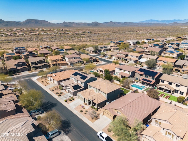 drone / aerial view featuring a mountain view and a residential view