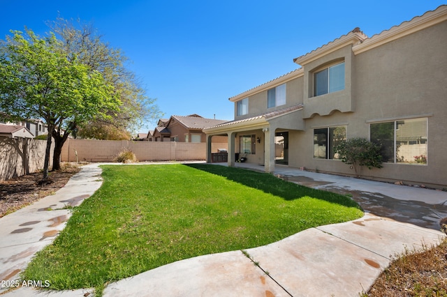 view of yard with a patio and a fenced backyard