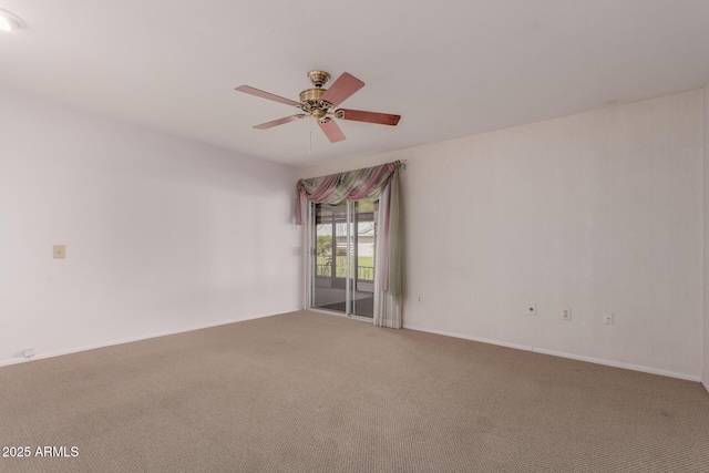 spare room with ceiling fan and carpet floors