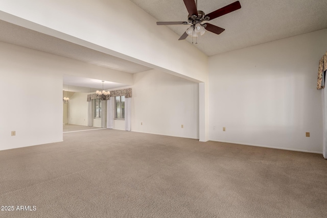 unfurnished room featuring carpet and ceiling fan with notable chandelier