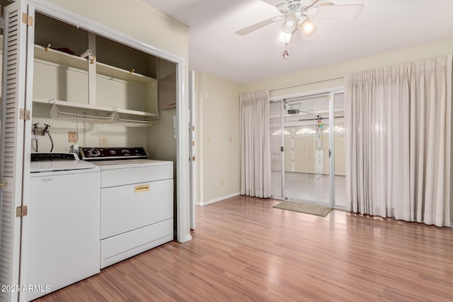 laundry area with laundry area, baseboards, ceiling fan, washer and dryer, and light wood-type flooring