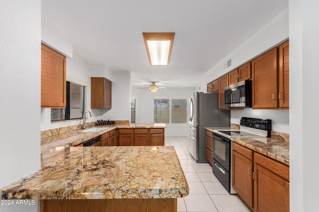 kitchen featuring ceiling fan, kitchen peninsula, black electric range oven, sink, and light tile patterned floors