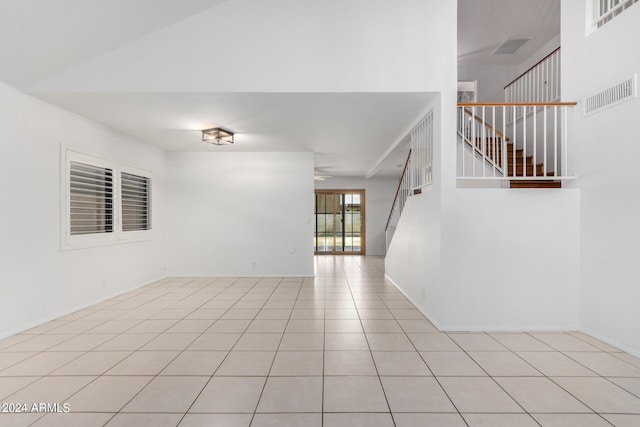 unfurnished room featuring light tile patterned flooring