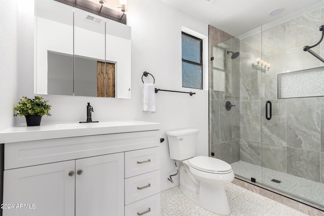 bathroom with a shower with door, tile patterned floors, toilet, and vanity