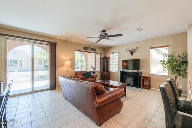 4975 W Gulch Dr, Eloy, AZ 85131 - living room with a wealth of natural light, light tile patterned floors, visible vents, and a ceiling fan