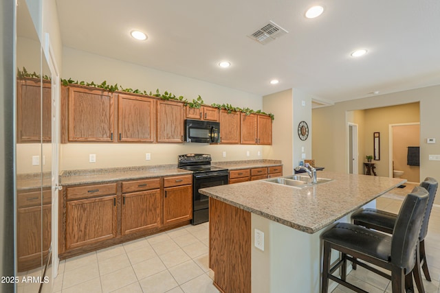 4975 W Gulch Dr, Eloy, AZ 85131 - kitchen featuring a sink, visible vents, black appliances, and brown cabinets