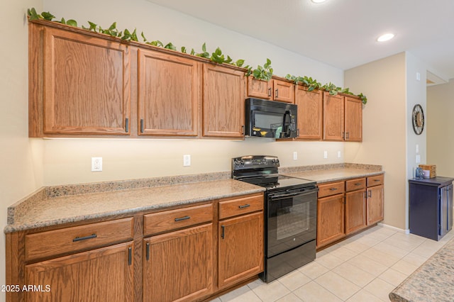 4975 W Gulch Dr, Eloy, AZ 85131 - kitchen featuring light tile patterned floors, black appliances, recessed lighting, light countertops, and brown cabinets