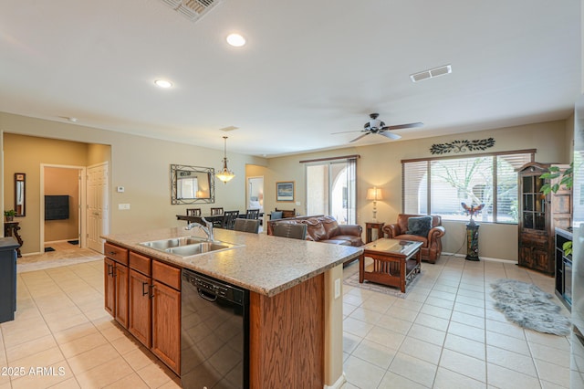 4975 W Gulch Dr, Eloy, AZ 85131 - kitchen featuring light tile patterned floors, black dishwasher, visible vents, brown cabinetry, and a sink