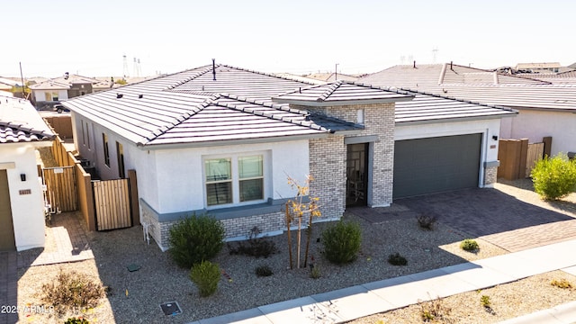 ranch-style home featuring a garage