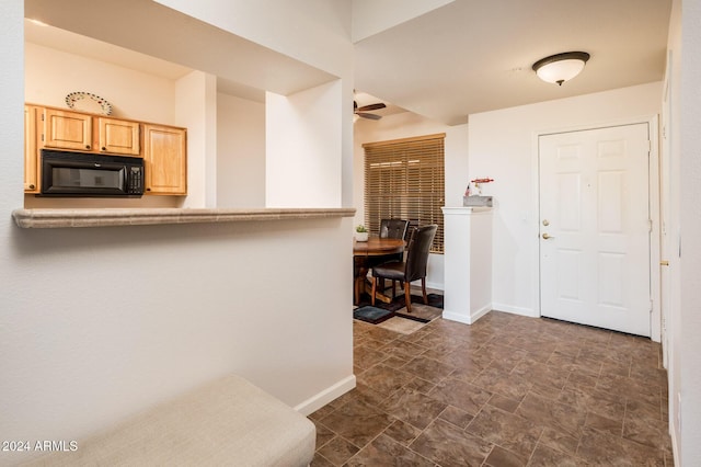 14950 W Mountain View Blvd Unit 1305, Surprise, AZ 85374 - foyer entrance with a ceiling fan, baseboards, and stone finish floors