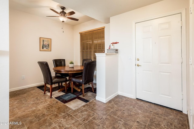 14950 W Mountain View Blvd Unit 1305, Surprise, AZ 85374 - dining area featuring a ceiling fan, baseboards, and stone finish floors