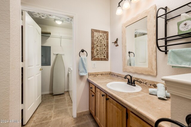 14950 W Mountain View Blvd Unit 1305, Surprise, AZ 85374 - bathroom with electric panel, vanity, baseboards, and tile patterned flooring