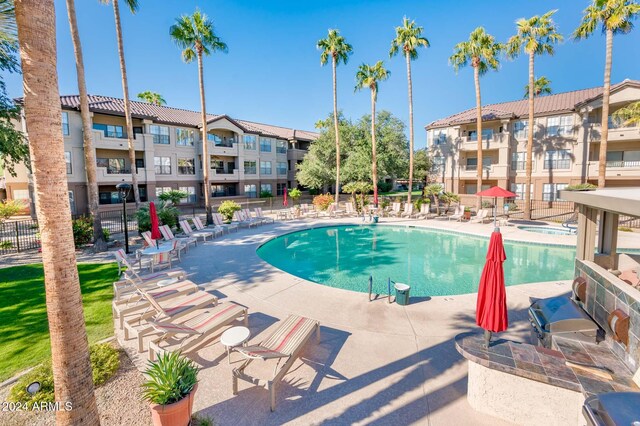 14950 W Mountain View Blvd Unit 1305, Surprise, AZ 85374 - community pool with a patio area and fence