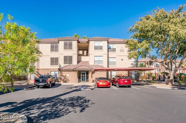 14950 W Mountain View Blvd Unit 1305, Surprise, AZ 85374 - view of building exterior featuring covered and uncovered parking