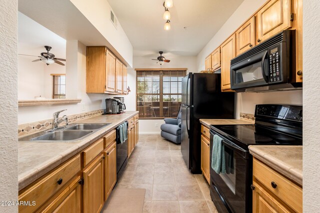 14950 W Mountain View Blvd Unit 1305, Surprise, AZ 85374 - kitchen featuring black appliances, a ceiling fan, a sink, light tile patterned flooring, and baseboards