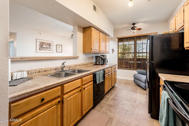14950 W Mountain View Blvd Unit 1305, Surprise, AZ 85374 - kitchen with ceiling fan, a sink, dishwasher, and baseboards