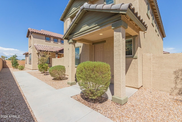 812 E Agua Fria Ln, Avondale, AZ 85323 - doorway to property with stucco siding and fence