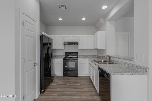 812 E Agua Fria Ln, Avondale, AZ 85323 - kitchen featuring a sink, white cabinets, under cabinet range hood, visible vents, and black appliances