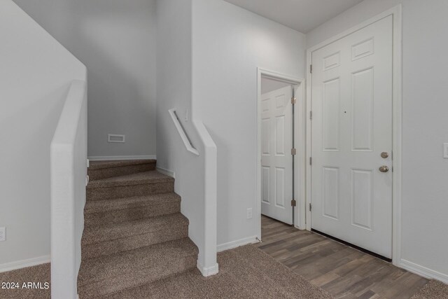 812 E Agua Fria Ln, Avondale, AZ 85323 - stairs featuring baseboards, visible vents, and wood finished floors