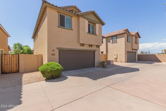 812 E Agua Fria Ln, Avondale, AZ 85323 - view of front of property with a garage, driveway, and stucco siding