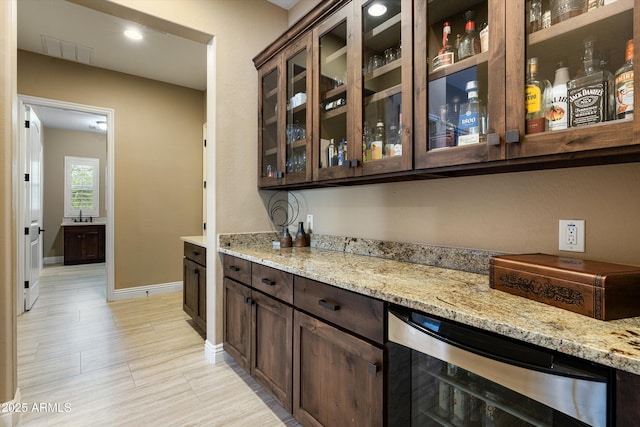 35971 N Prickley Pear Rd, Cave Creek, AZ 85331 - bar area with beverage cooler, baseboards, and a sink
