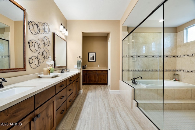 35971 N Prickley Pear Rd, Cave Creek, AZ 85331 - bathroom featuring a garden tub, tiled shower, double vanity, and baseboards