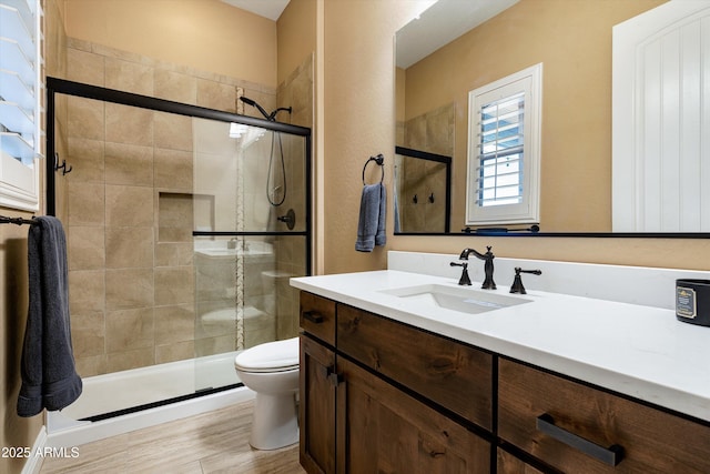 35971 N Prickley Pear Rd, Cave Creek, AZ 85331 - bathroom featuring a stall shower, vanity, toilet, and wood finished floors