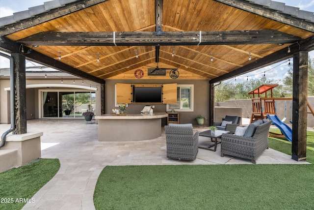 35971 N Prickley Pear Rd, Cave Creek, AZ 85331 - view of patio / terrace with exterior bar, outdoor lounge area, a playground, and area for grilling