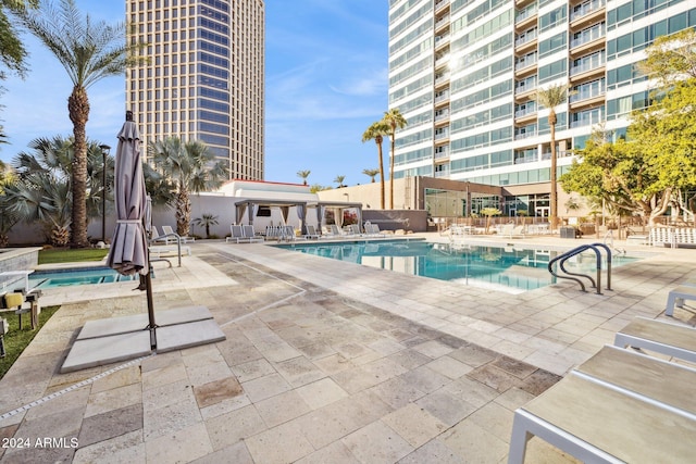 view of swimming pool with a patio