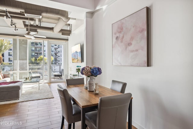 dining space featuring ceiling fan and wood-type flooring