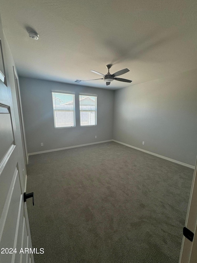 3375 W Verde River Rd, San Tan Valley, AZ 85144 - spare room featuring ceiling fan and dark carpet