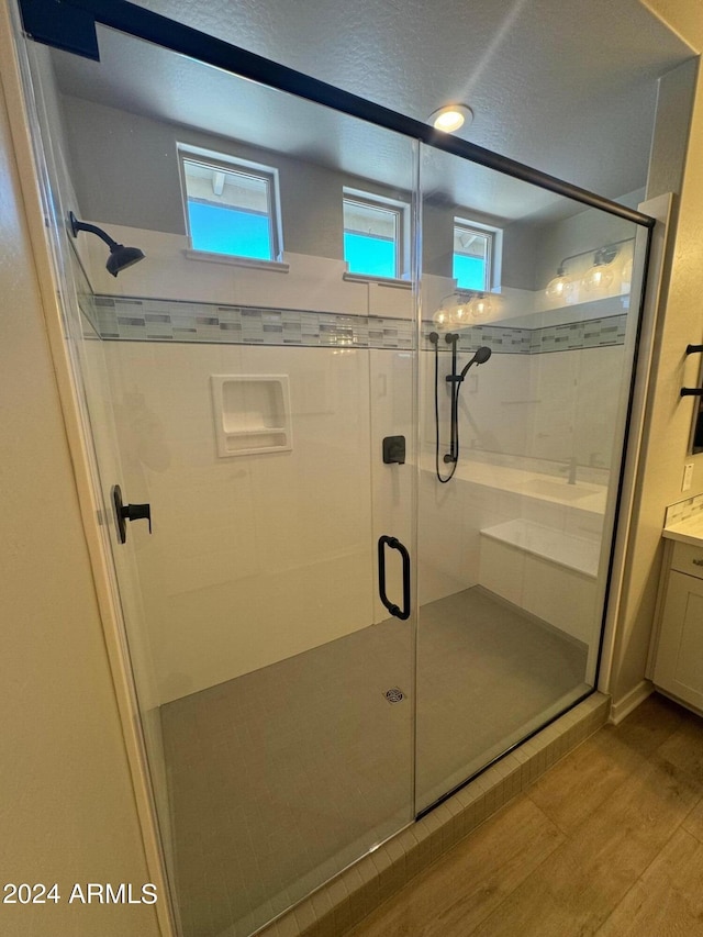 3375 W Verde River Rd, San Tan Valley, AZ 85144 - bathroom with wood finished floors, a shower stall, and vanity