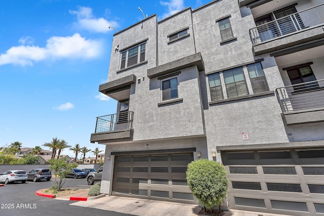 2090 S Dorsey Ln Unit 1037, Tempe, AZ 85282 - view of building exterior featuring a garage