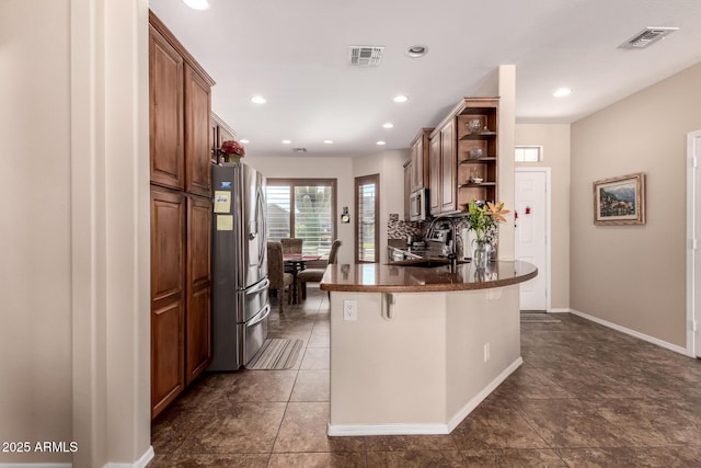 kitchen with visible vents, open shelves, a peninsula, a sink, and stainless steel appliances