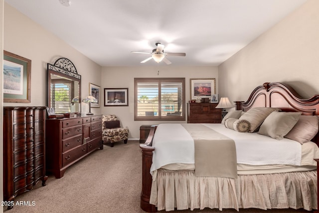 carpeted bedroom featuring multiple windows and ceiling fan