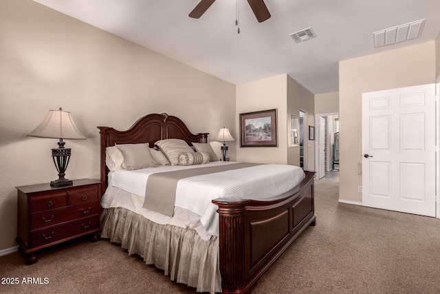 bedroom with visible vents, dark carpet, and a ceiling fan