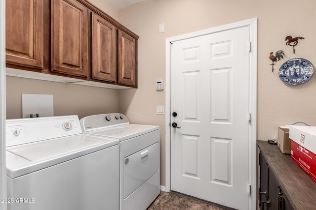 laundry area with cabinet space and independent washer and dryer