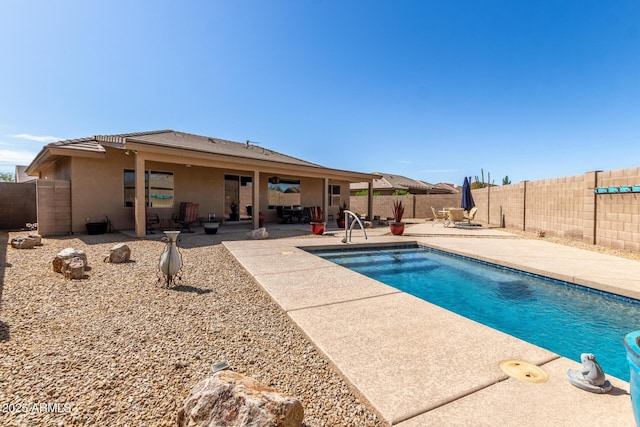 view of swimming pool featuring a patio, a fenced backyard, and a fenced in pool