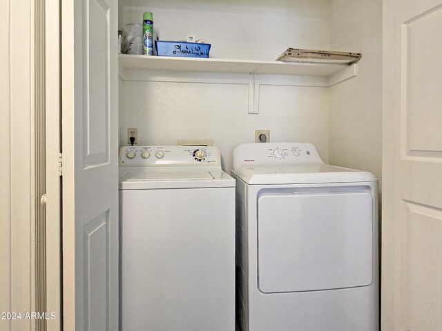 laundry area featuring laundry area and washer and clothes dryer