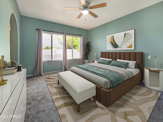 carpeted bedroom featuring a ceiling fan