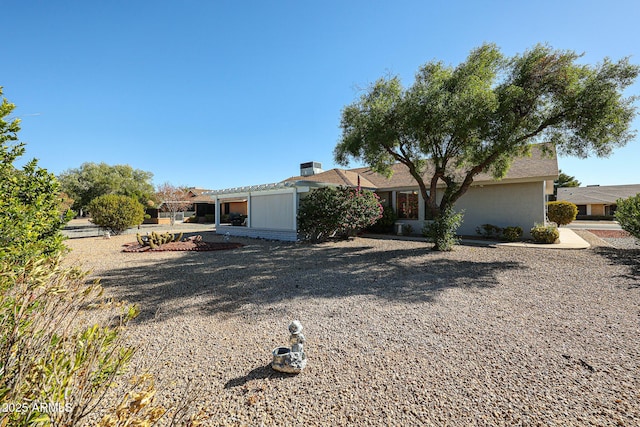 view of front of home with a pergola