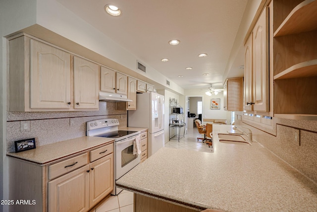 kitchen with kitchen peninsula, white appliances, ceiling fan, light brown cabinets, and light tile patterned floors