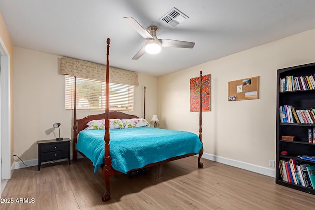 6532 E Aster Dr, Scottsdale, AZ 85254 - bedroom featuring wood finished floors, baseboards, and a ceiling fan