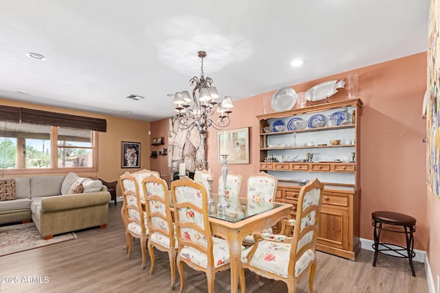 6532 E Aster Dr, Scottsdale, AZ 85254 - dining area featuring a chandelier, light wood-style floors, and recessed lighting