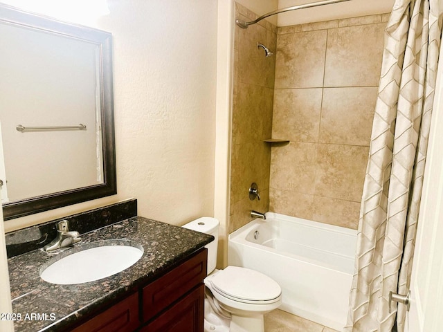 full bathroom with vanity, shower / tub combo, and toilet